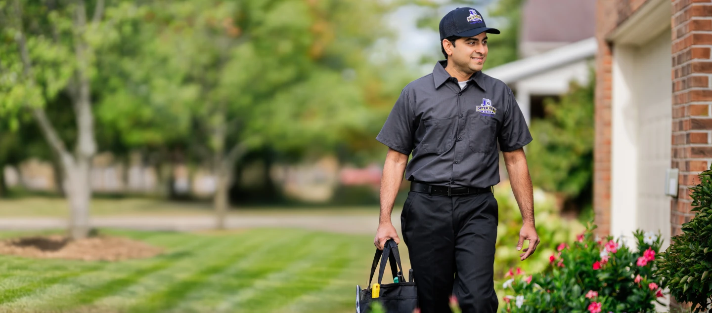 Technician approaching front door.