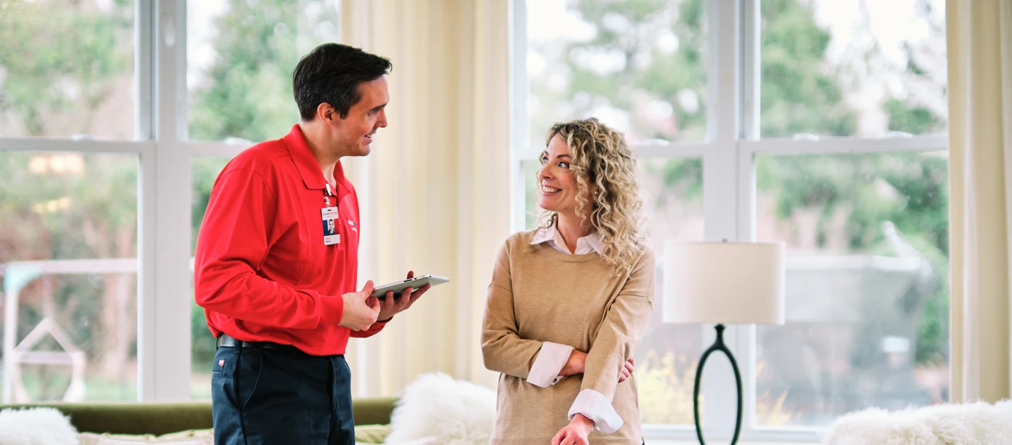 Technician speaking with customer.