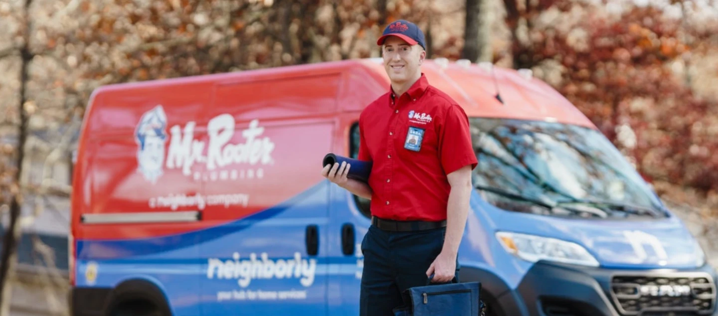 Mr. Rooter van and service professional.