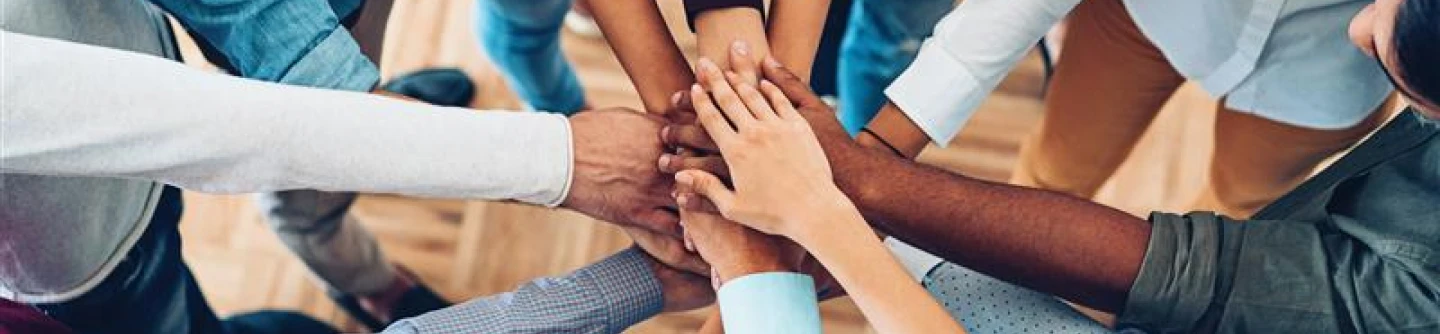 Yellow flower in hand.