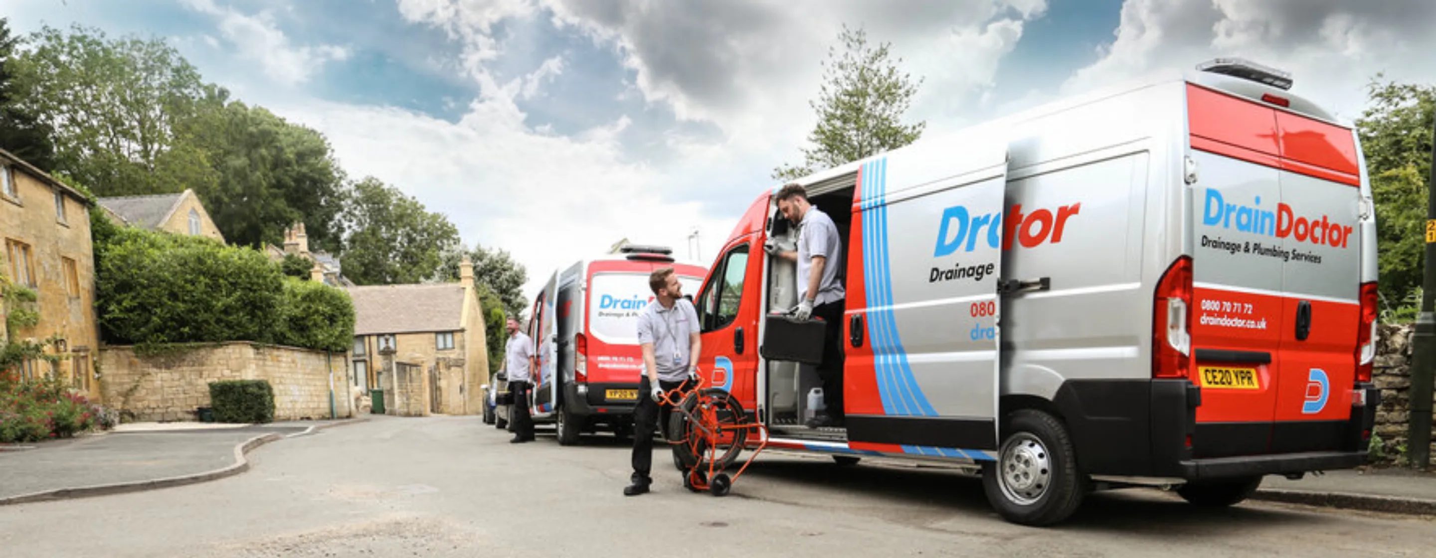 Drain Doctor branded trucks and technicians.