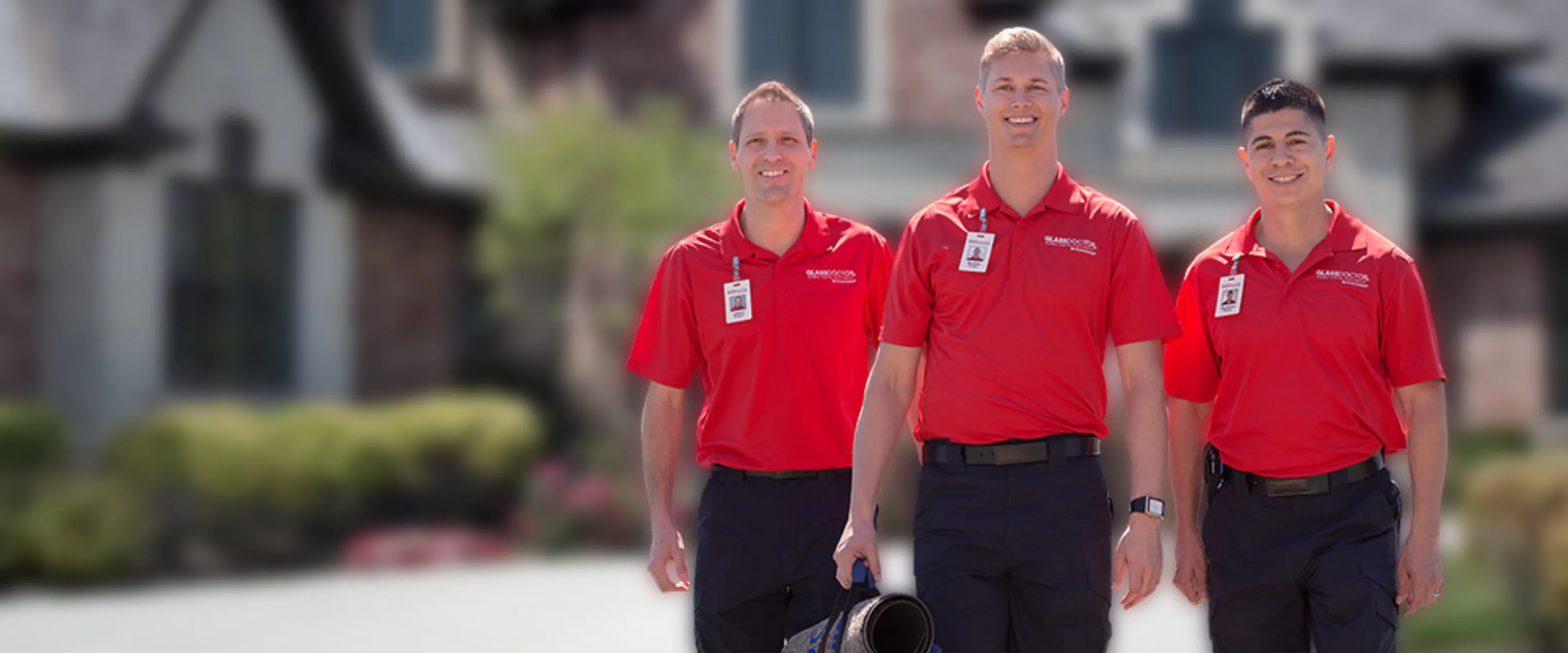 Glass Doctor male technicians wearing branded polo shirts.