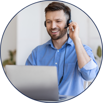 Man on laptop with headset