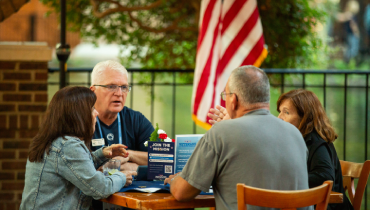 Group of people sitting at table.